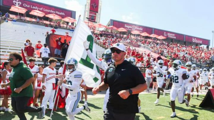 Tulane head coach Jon Sumrall leads the team into the stadium for their game against Louisiana Ragin' Cajuns at Cajun Field on Saturday, September 21st, 2024. Tulane head coach Jon Sumrall leads the team into the stadium for their game against Louisiana Ragin' Cajuns at Cajun Field on Saturday, September 21st, 2024.