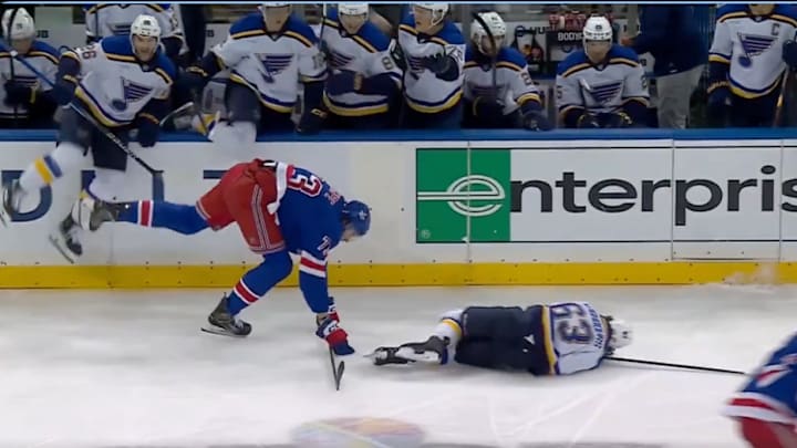 New York Rangers winger Matt Rempe knocks over St. Louis Blues forward Jake Neighbours.