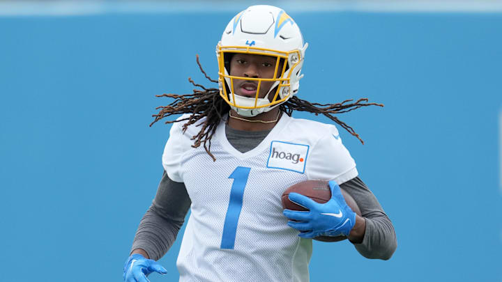 Jun 13, 2023; Costa Mesa, CA, USA; Los Angeles Chargers receiver Quentin Johnston (1) carries the