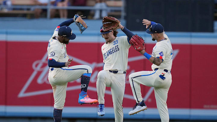 Jul 6, 2024; Los Angeles, California, USA; Los Angeles Dodgers left fielder Teoscar Hernandez (37), center fielder James Outman (33) and right fielder Andy Pages (44) celebrate after the game against the Milwaukee Brewers at Dodger Stadium. Mandatory Credit: Kirby Lee-Imagn Images Jul 6, 2024; Los Angeles, California, USA; Los Angeles Dodgers left fielder Teoscar Hernandez (37), center fielder James Outman (33) and right fielder Andy Pages (44) celebrate after the game against the Milwaukee Brewers at Dodger Stadium. Mandatory Credit: Kirby Lee-Imagn Images