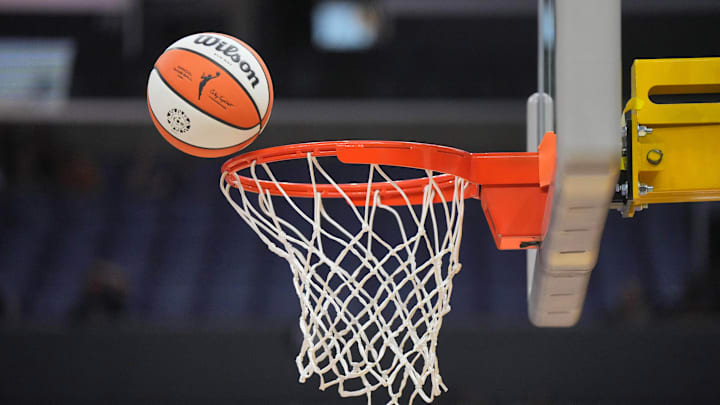 Jul 7, 2024; Los Angeles, California, USA; A Wilson official WNBA Evo NXT basketball approaches the net and rim at the Crypto.com Arena. Mandatory Credit: Kirby Lee-Imagn Images