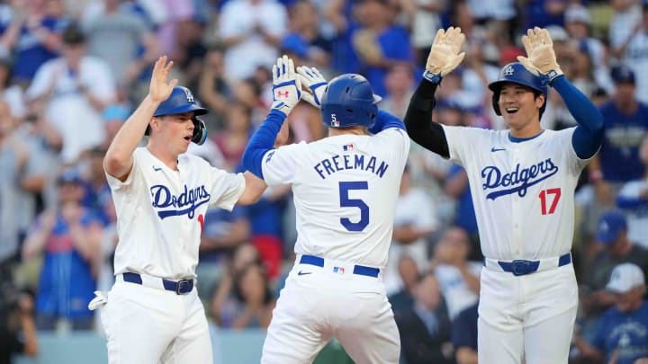 Jul 3, 2024; Los Angeles, California, USA; Los Angeles Dodgers first baseman Freddie Freeman (5) celebrates with catcher Will Smith (16) and designated hitter Shohei Ohtani (17) after hitting a three-run home run in the first inning against the Arizona Diamondbacks at Dodger Stadium. Mandatory Credit: Kirby Lee-USA TODAY Sports