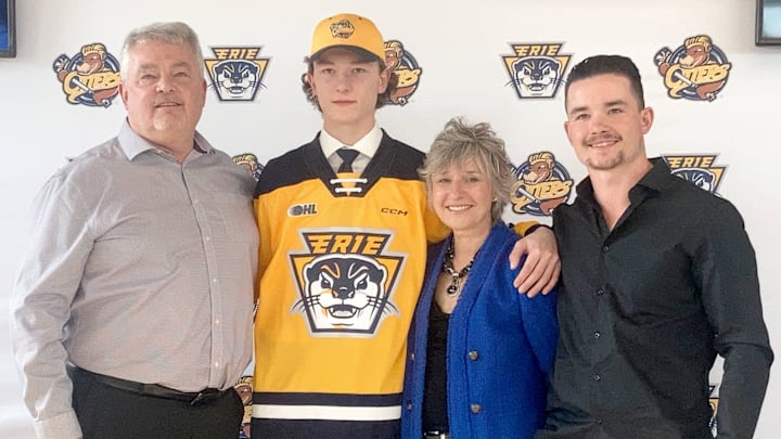 Matthew Schaefer, whom the Erie Otters will choose with the No. 1 overall pick in the 2023 Ontario Hockey League priority selection draft, poses with his family during the team's April 20, 2023, event to announce his impending selection. Posing with Schaefer, a defenseman, are (left to right) his father Todd; his mother, Jennifer; and his brother, Johnny.

P1schaefer042023jpg