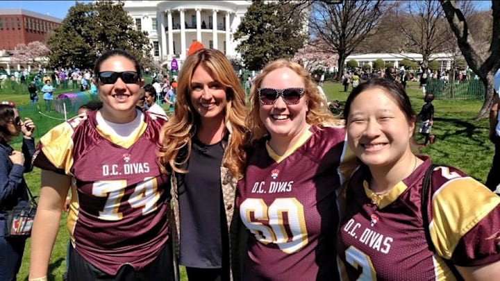 Rachel Worsham, second from right, was named the head football coach at a Virginia high school. She is the first female head football coach in the state.