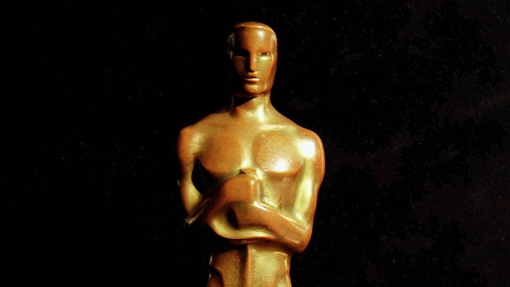Oscars statue in front of black background