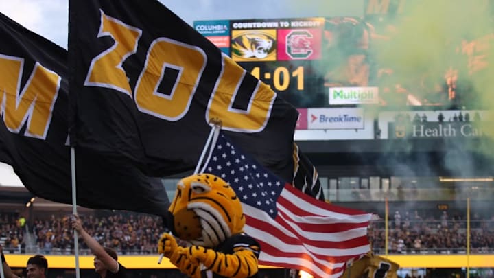 Sept 20, 2025; Columbia, Missouri, USA; Truman the Tiger, Missouri's mascot, runs out with the team before kick off between the Missouri Tigers and South Carolina Gamecocks at Faurot Field.