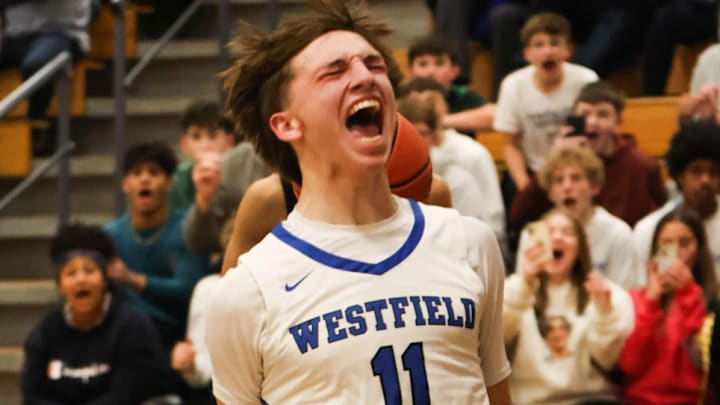Westfield's Carson Swanson celebrates after scoring his 2,000th career point, with a dunk. It was part of an incredible 43-point triple-double performance during a 87-40 win over Maple Grove.