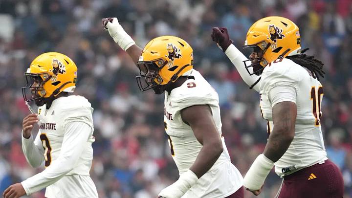 Sep 19, 2026; London, ENG; Arizona State Sun Devils defensive back Lyrik Rawls (5) and utility player Clayton Smith (10) react after a play against the Kansas Jayhawks during the first quarter at Wembley Stadium. Sep 19, 2026; London, ENG; Arizona State Sun Devils defensive back Lyrik Rawls (5) and utility player Clayton Smith (10) react after a play against the Kansas Jayhawks during the first quarter at Wembley Stadium.