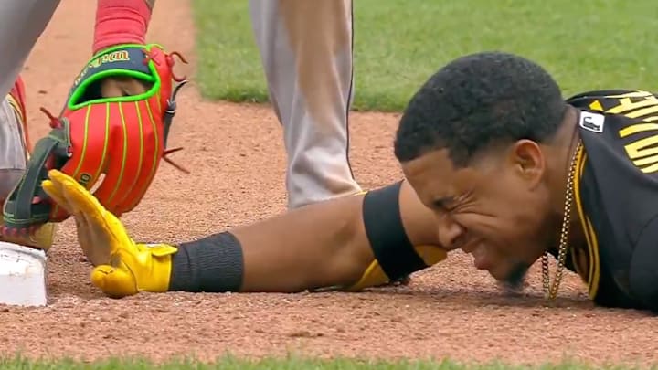 Pirates first baseman Enmanuel Valdez was called out at third after being tagged while asking the ump for time. 
