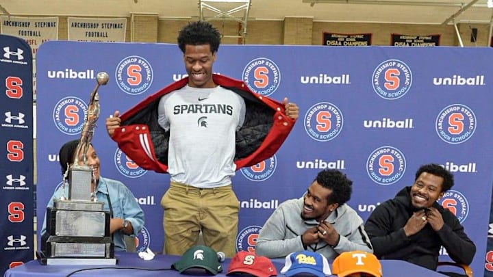 Stepinac High School basketball star Jasiah Jervis unveils a Michigan State University t-shirt as he announces which college he will be attending and playing basketball at during a ceremony at Stepinac High School in White Plains Nov. 5, 2025. With Jasiah was his mother Falana, his father Rhodes, and brother Jafari. Stepinac High School basketball star Jasiah Jervis unveils a Michigan State University t-shirt as he announces which college he will be attending and playing basketball at during a ceremony at Stepinac High School in White Plains Nov. 5, 2025. With Jasiah was his mother Falana, his father Rhodes, and brother Jafari.