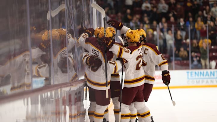 Gophers celebrating a goal against St. Thomas