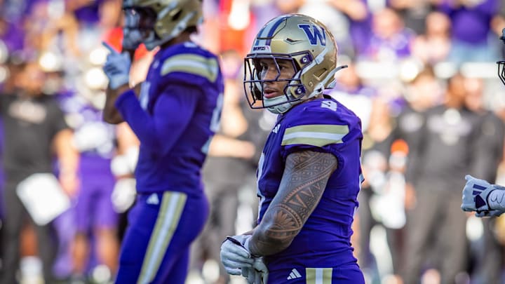 Jacob Manu surveys the field in the Ohio State game, which was his first start as a Husky. 
