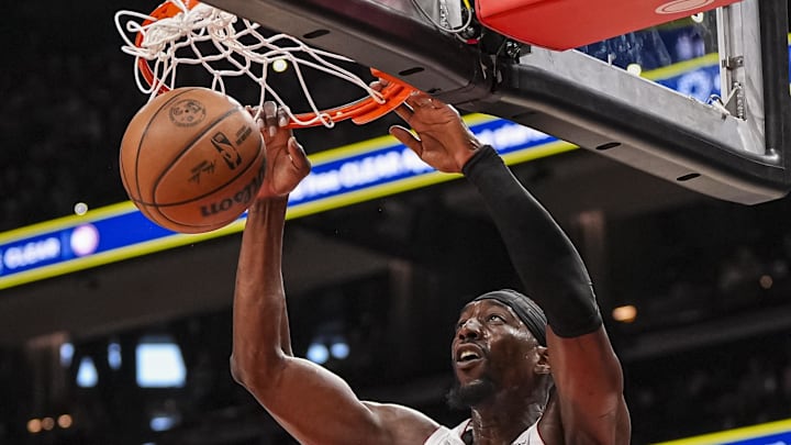 Dec 28, 2024; Atlanta, Georgia, USA; Miami Heat center Bam Adebayo (13) dunks behind Atlanta Hawks forward Zaccharie Risacher (10) during the first half at State Farm Arena. Mandatory Credit: Dale Zanine-Imagn Images