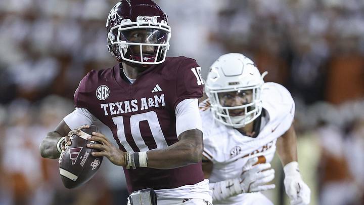 Texas A&M Aggies quarterback Marcel Reed (10) looks for an open receiver as Texas Longhorns linebacker Trey Moore (8) defends during the fourth quarter at Kyle Field. Texas A&M Aggies quarterback Marcel Reed (10) looks for an open receiver as Texas Longhorns linebacker Trey Moore (8) defends during the fourth quarter at Kyle Field.