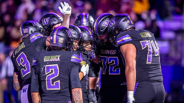 Demond Williams Jr. is surrounded by his Husky teammates after scoring late. Demond Williams Jr. is surrounded by his Husky teammates after scoring late.