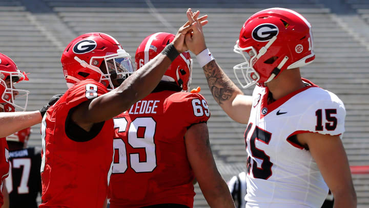 Georgia wide receiver Colbie Young (8) coal celebrates with Georgia quarterback Carson Beck (15) after scoring a touchdown during the G-Day spring football game in Athens, Ga., on Saturday, April 13, 2024.