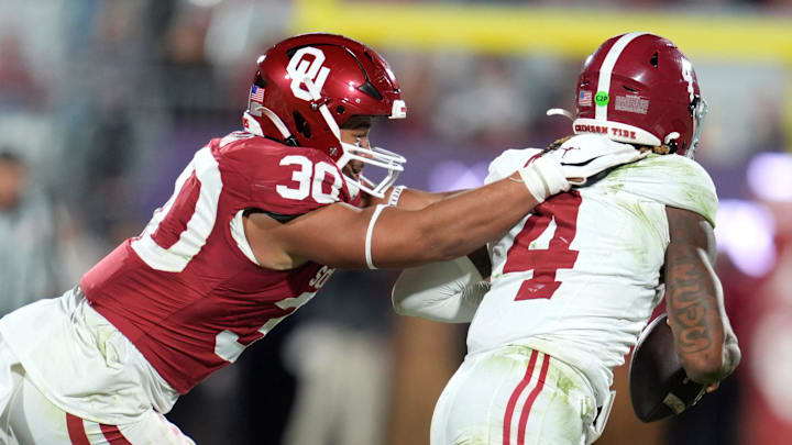 Oklahoma Sooners defensive lineman Trace Ford (30) chases after Alabama Crimson Tide quarterback Jalen Milroe (4) during a college football game between the University of Oklahoma Sooners (OU) and the Alabama Crimson Tide at Gaylord Family - Oklahoma Memorial Stadium in Norman, Okla., Saturday, Nov. 23, 2024. Oklahoma won 24-3.