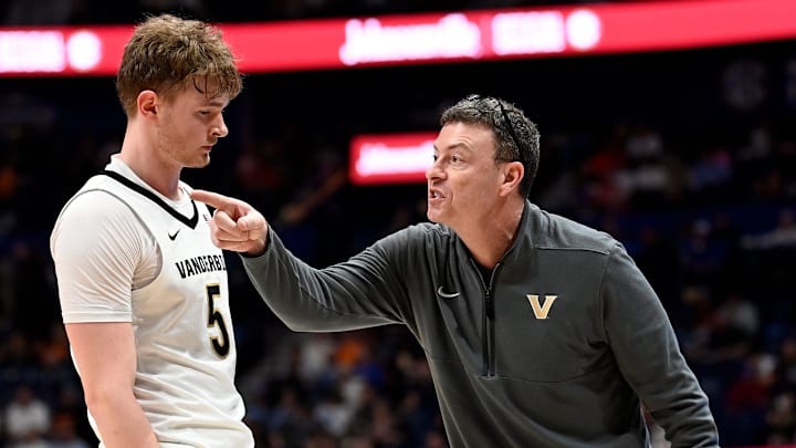 Vanderbilt head coach Mark Byington talks with guard Tyler Nickel (5) during a NCAA college basketball first round game against Texas at the men’s Southeastern Conference Tournament Wednesday, March 12, 2025, in Nashville, Tenn. Vanderbilt lost 79-72.