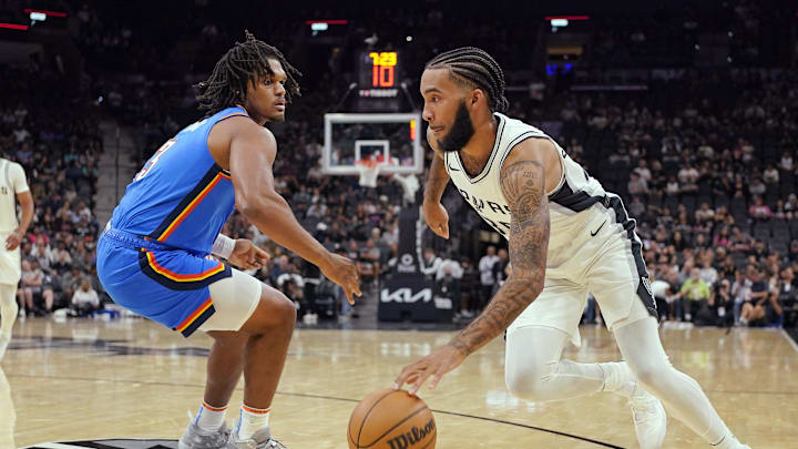 Oct 7, 2024; San Antonio, Texas, USA; San Antonio Spurs forward Julian Champagne (30) drives the basket while defended by Oklahoma City Thunder forward Dillon Jones (3) during the first half at Frost Bank Center. Mandatory Credit: Scott Wachter-Imagn Images