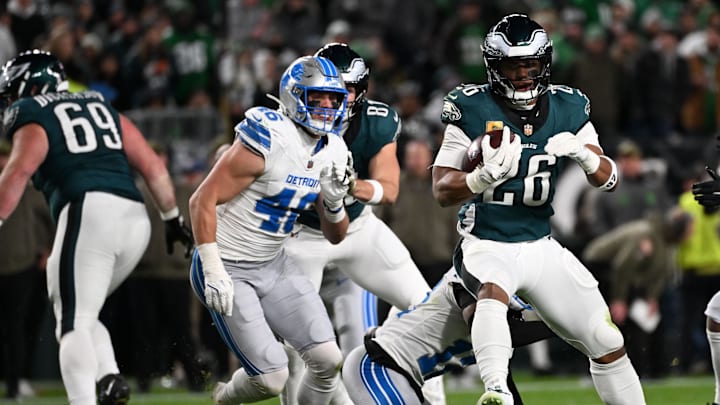 Nov 16, 2025; Philadelphia, Pennsylvania, USA; Philadelphia Eagles running back Saquon Barkley (26) rushes the ball against the Detroit Lions during the first half at Lincoln Financial Field. Mandatory Credit: Eric Hartline-Imagn Images