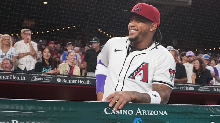 Arizona Diamondbacks infielder Ketel Marte (4) smiles from the dugout during their Opening Day game against the Chicago Cubs at Chase Field in Phoenix, on March 27, 2025.