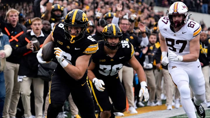 Iowa Hawkeyes defensive back Zach Lutmer (6) returns an interception for a touchdown against the Minnesota Golden Gophers Oct. 25, 2025 at Kinnick Stadium in Iowa City, Iowa.