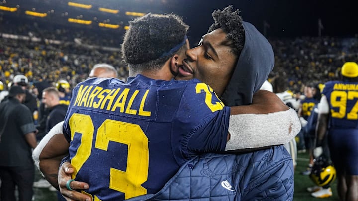 Michigan running back Jordan Marshall (23) hugs running back Justice Haynes (22) after a 21-16 win over Purdue at Michigan Stadium in Ann Arbor on Saturday, November 1, 2025. Michigan running back Jordan Marshall (23) hugs running back Justice Haynes (22) after a 21-16 win over Purdue at Michigan Stadium in Ann Arbor on Saturday, November 1, 2025.