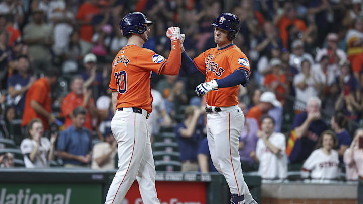 Sep 20, 2024; Houston, Texas, USA; Houston Astros third baseman Alex Bregman (2) celebrates with right fielder Kyle Tucker (30) after hitting a home run during the third inning at Minute Maid Park.