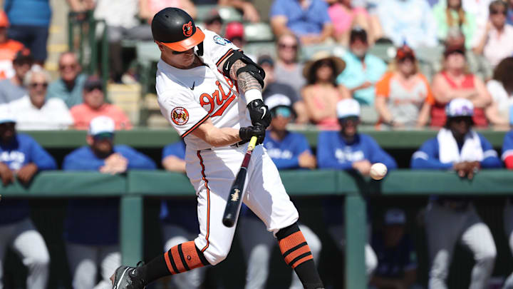 Feb 27, 2025; Sarasota, Florida, USA;  Baltimore Orioles outfielder Tyler O'Neill (9) hits a 3-run home run during the second inning against the Toronto Blue Jays at Ed Smith Stadium. Mandatory Credit: Kim Klement Neitzel-Imagn Images