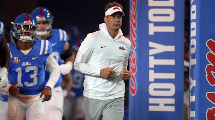 Nov 15, 2025; Oxford, Mississippi, USA; Mississippi Rebels head coach Lane Kiffin runs out of the tunnel prior to the game against the Florida Gators at Vaught-Hemingway Stadium. Mandatory Credit: Petre Thomas-Imagn Images