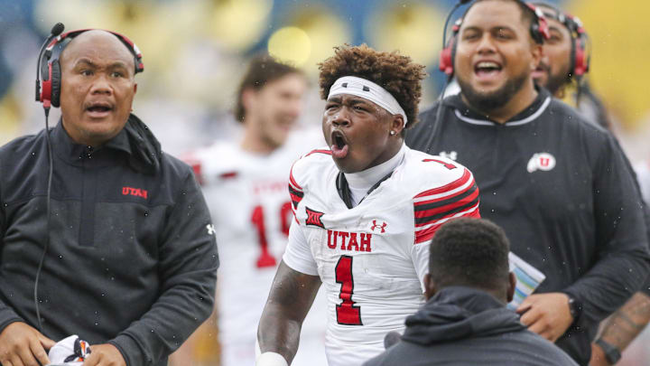Utah Utes running back Wayshawn Parker (1) celebrates after his touchdown catch was ruled a catch during the third quarter against the West Virginia Mountaineers at Milan Puskar Stadium.