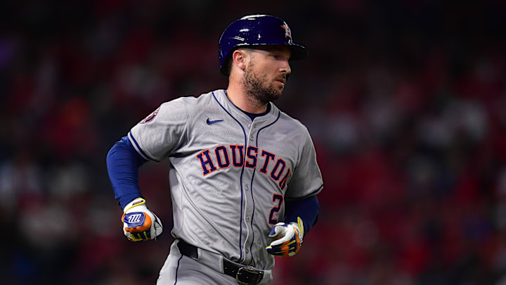 Sep 13, 2024; Anaheim, California, USA; Houston Astros third baseman Alex Bregman (2) hits a single against the Los Angeles Angels during the seventh inning at Angel Stadium. Mandatory Credit: Gary A. Vasquez-Imagn Images