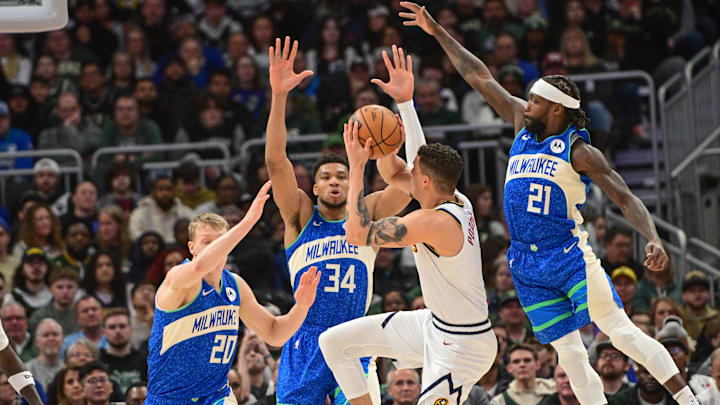 Feb 12, 2024; Milwaukee, Wisconsin, USA; Denver Nuggets forward Michael Porter Jr. (1) looks for a shot against Milwaukee Bucks guard AJ Green (20), forward Giannis Antetokounmpo (34) and guard Patrick Beverley (21) in the second quarter at Fiserv Forum. Mandatory Credit: Benny Sieu-Imagn Images Feb 12, 2024; Milwaukee, Wisconsin, USA; Denver Nuggets forward Michael Porter Jr. (1) looks for a shot against Milwaukee Bucks guard AJ Green (20), forward Giannis Antetokounmpo (34) and guard Patrick Beverley (21) in the second quarter at Fiserv Forum. Mandatory Credit: Benny Sieu-Imagn Images
