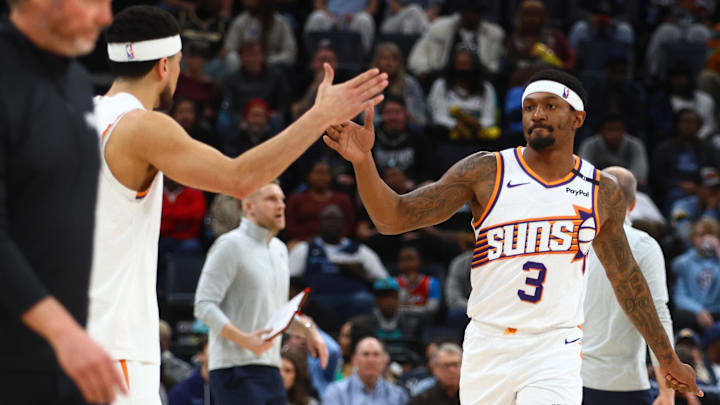 Feb 25, 2025; Memphis, Tennessee, USA; Phoenix Suns guard Bradley Beal (3) reacts with Phoenix Suns guard Devin Booker (1) during the second quarter against the Memphis Grizzlies at FedExForum. Mandatory Credit: Petre Thomas-Imagn Images