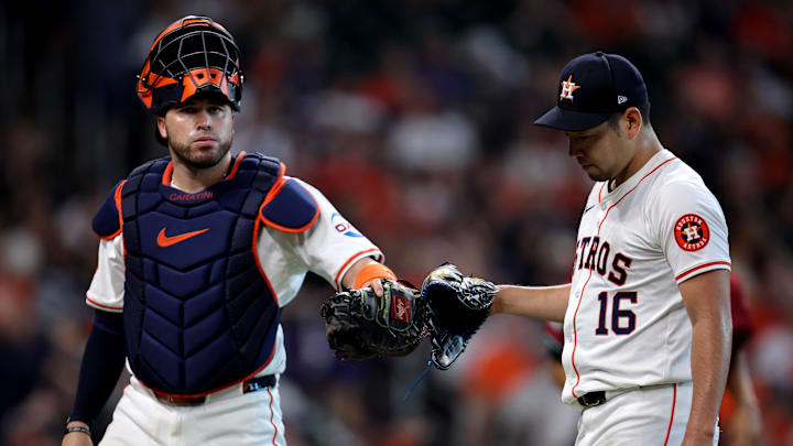Sep 7, 2024; Houston, Texas, USA; Houston Astros catcher Victor Caratini (17) congratulates Houston Astros starting pitcher Yusei Kikuchi (16) after retiring the side against the Arizona Diamondbacks during the sixth inning at Minute Maid Park.