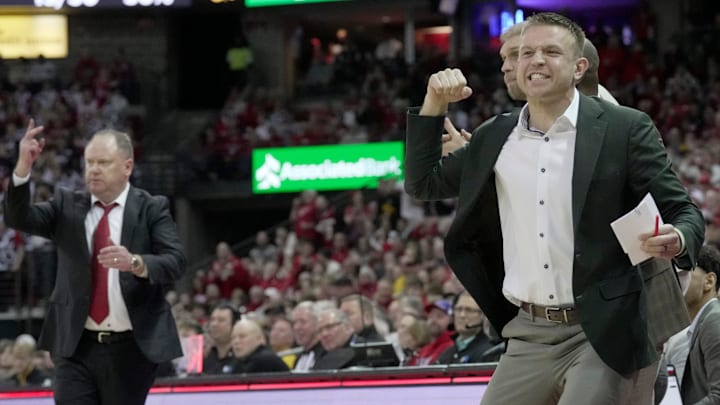 Wisconsin special assistant to the head coach Brad Davison reacts after an Iowa foul during the second half of the game Sunday, February 22, 2026 at the Kohl Center in Madison, Wisconsin. Wisconsin beat Iowa 84-71.