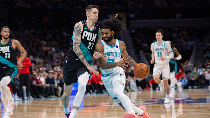 Charlotte Hornets guard Coby White (3) drives to the basket against Portland Trail Blazers guard Vit Krejci