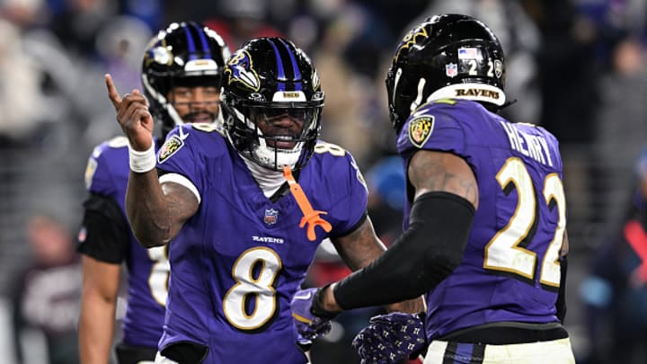 Derrick Henry #22 of the Baltimore Ravens celebrates with Lamar Jackson #8 after scoring touchdown against the Cleveland Browns at M&T Bank Stadium on January 04, 2025 in Baltimore, Maryland. 
