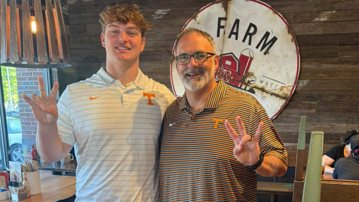Four-star interior offensive lineman Carter Jones with Vols OL coach, Coach Elarbee.
