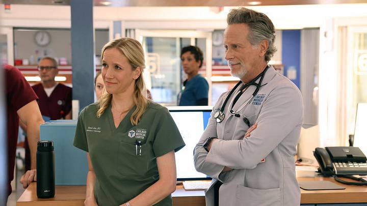CHICAGO MED - "They Call Me Ms. Goodwin" Episode 1203 - Pictured: Jessy Schram as Dr. Hannah Asher, Steven Weber as Dr. Dean Archer 