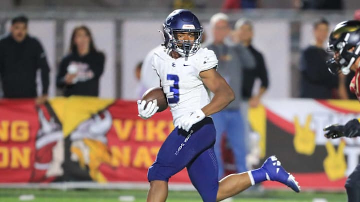 Sierra Canyon running back Jaxsen Stokes breaks into the open field on a run against Downey. Sierra Canyon running back Jaxsen Stokes breaks into the open field on a run against Downey.