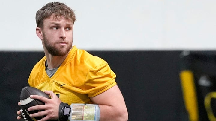 Iowa quarterback Mark Gronowski (11) walks through a drill at practice Thursday, April 3, 2025 in Iowa City, Iowa.
