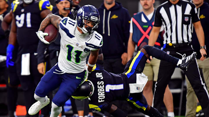 Nov 16, 2025; Inglewood, California, USA; Seattle Seahawks wide receiver Jaxon Smith-Njigba (11) against Los Angeles Rams cornerback Emmanuel Forbes Jr. (1) during the second half at SoFi Stadium. 