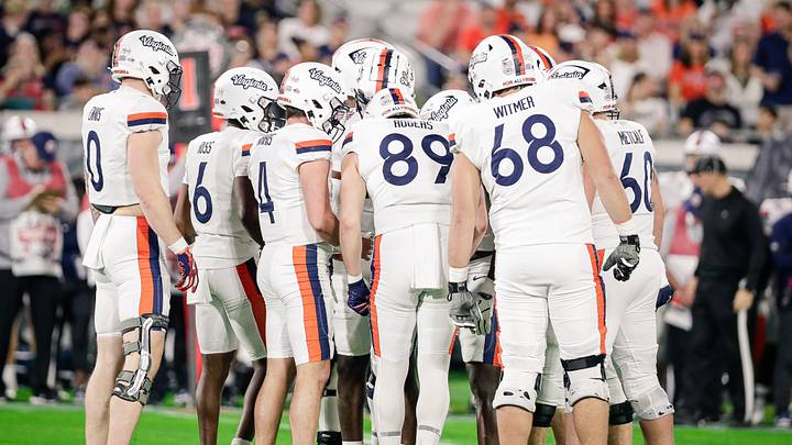 Dec 27, 2025; Jacksonville, FL, USA; Virginia Cavaliers offensive players huddle during the Gator Bowl against the Missouri Tigers at EverBank Stadium. Mandatory Credit: Travis Register-Imagn Images Dec 27, 2025; Jacksonville, FL, USA; Virginia Cavaliers offensive players huddle during the Gator Bowl against the Missouri Tigers at EverBank Stadium. Mandatory Credit: Travis Register-Imagn Images