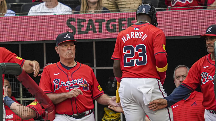 Atlanta Braves center fielder Michael Harris II and manager Brian Snitker. Atlanta Braves center fielder Michael Harris II and manager Brian Snitker.