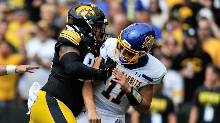 Sep 3, 2022; Iowa City, Iowa, USA; Iowa Hawkeyes defensive lineman Noah Shannon (99) shoves South Dakota State Jackrabbits quarterback Mark Gronowski (11) during the first quarter at Kinnick Stadium. Mandatory Credit: Jeffrey Becker-Imagn Images
