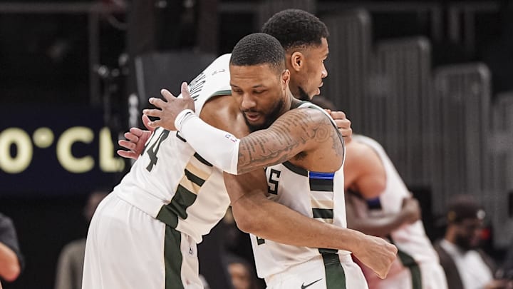 Mar 4, 2025; Atlanta, Georgia, USA: Milwaukee Bucks forward Giannis Antetokounmpo (34) and guard Damian Lillard (0) react after defeating the Atlanta Hawks at State Farm Arena. Mandatory Credit: Dale Zanine-Imagn Images