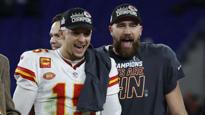 Kansas City Chiefs quarterback Patrick Mahomes (15) and Chiefs tight end Travis Kelce (R) celebrate on the stage prior to the trophy presentation after their' game against the Baltimore Ravens in the AFC Championship football game at M&T Bank Stadium. 