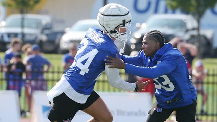 Bills defensive backs Cole Bishop, left, and Te'Cory Couch get in extra work on coverage before the start of day three of training camp.