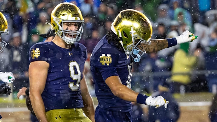 Nov 8, 2025; South Bend, Indiana, USA; Notre Dame Fighting Irish wide receiver Kk Smith (11) celebrates scoring along side tight end Eli Raridon (9) against the Navy Midshipmen during the second half at Notre Dame Stadium. Mandatory Credit: Michael Caterina-Imagn Images